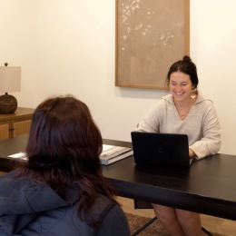two women sitting at a table