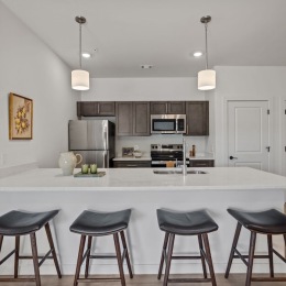 a kitchen with chairs