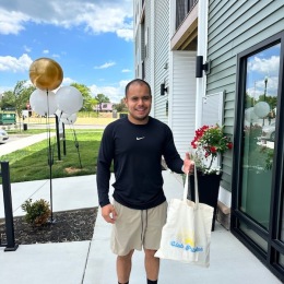 a man holding a gift